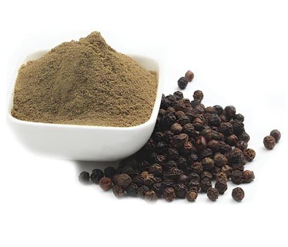 Black Pepper Powder A bowl of black pepper powder alongside whole black pepper.