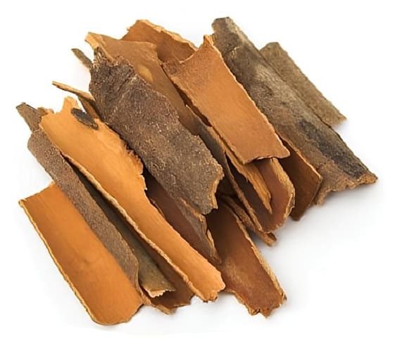 Cinnamon A collection of dried cinnamon sticks stacked together.