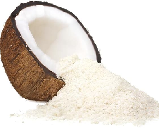 Coconut Powder Coconut powder displayed alongside a half piece of coconut.