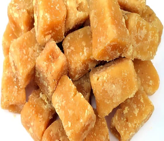 Jaggery A collection of jaggery stalks on clean white surface.