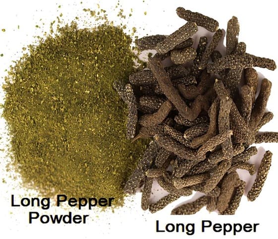 Long Pepper A close-up of long pepper powder with whole long pepper beside it.